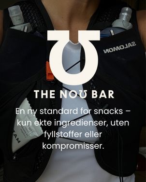 Dame med løpevest og energibar