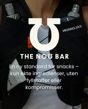 Dame med løpevest og energibar